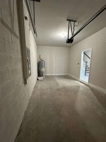 a view of an empty room with a floor to ceiling window