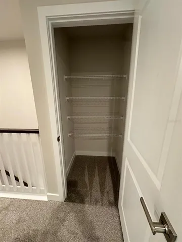 a bathroom with a sink vanity and toilet