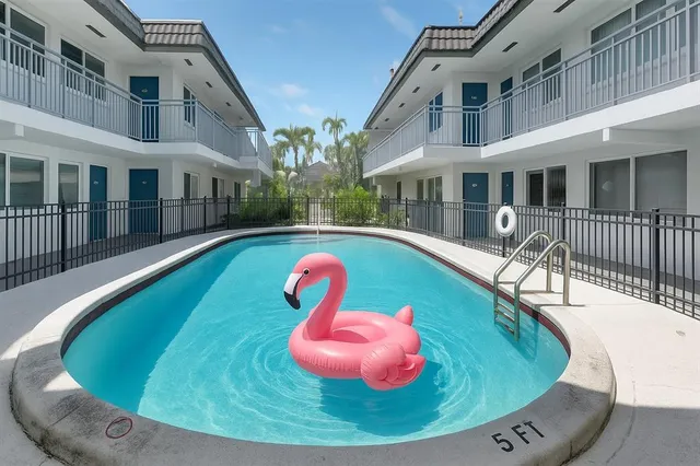 a view of a swimming pool with a porch