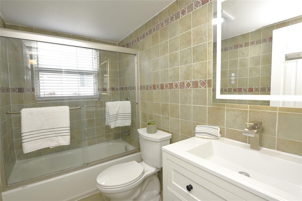 1010 Southeast 15th Street, Unit 112 Fort Lauderdale, FL 33316 - Photo 17 of 21 a bathroom with a sink toilet and shower