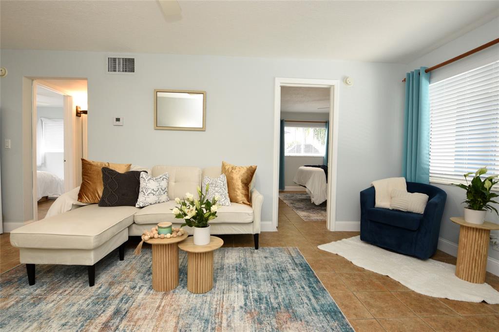 1010 Southeast 15th Street, Unit 112 Fort Lauderdale, FL 33316 - Photo 8 of 21 a living room with furniture and wooden floor