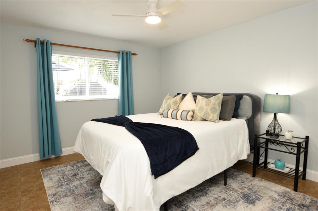 1010 Southeast 15th Street, Unit 112 Fort Lauderdale, FL 33316 - Photo 9 of 21 a bedroom with a bed and a window