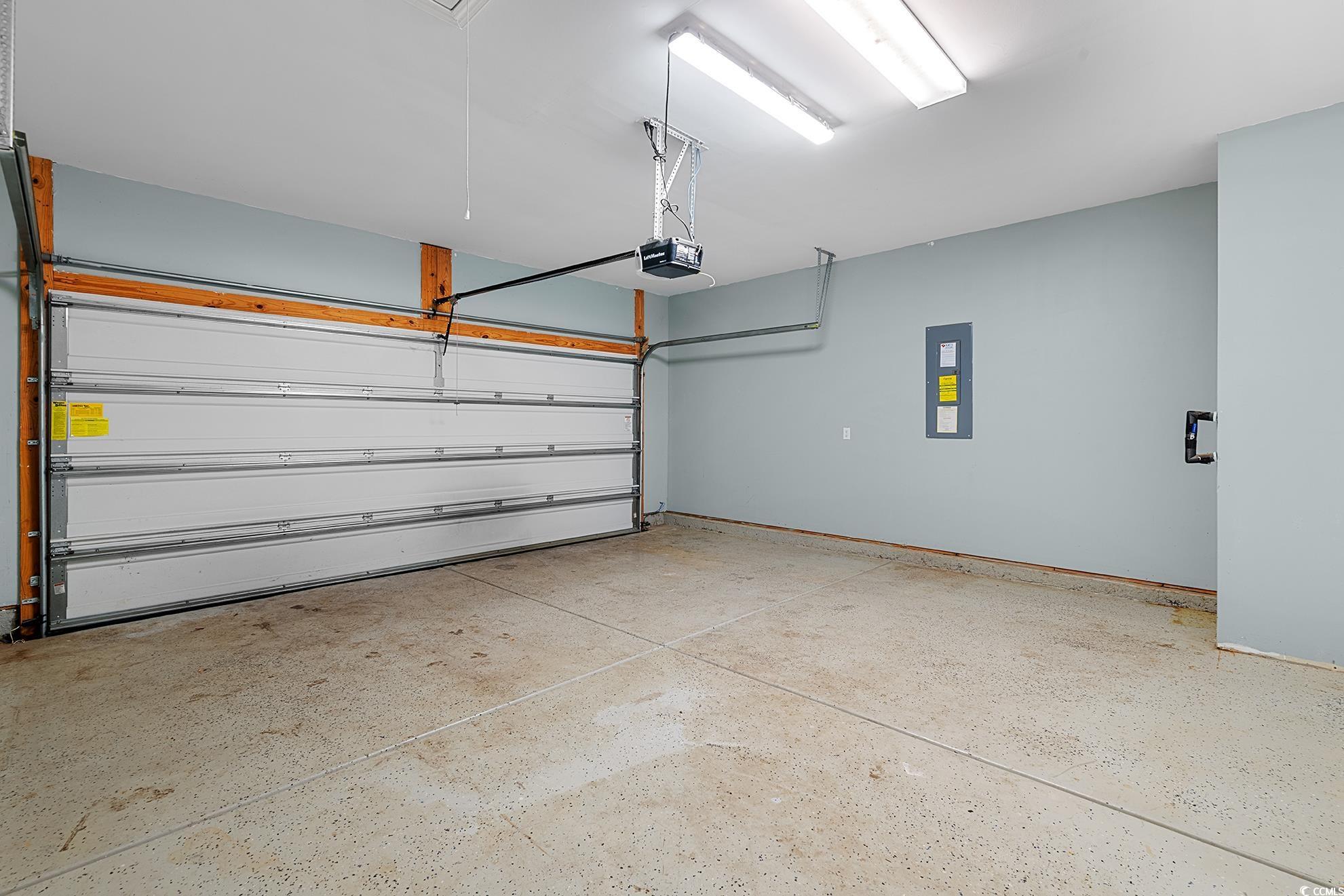292 Carmello Circle Conway, SC 29526 - Photo 23 of 33 Garage featuring electric panel and a garage door opener