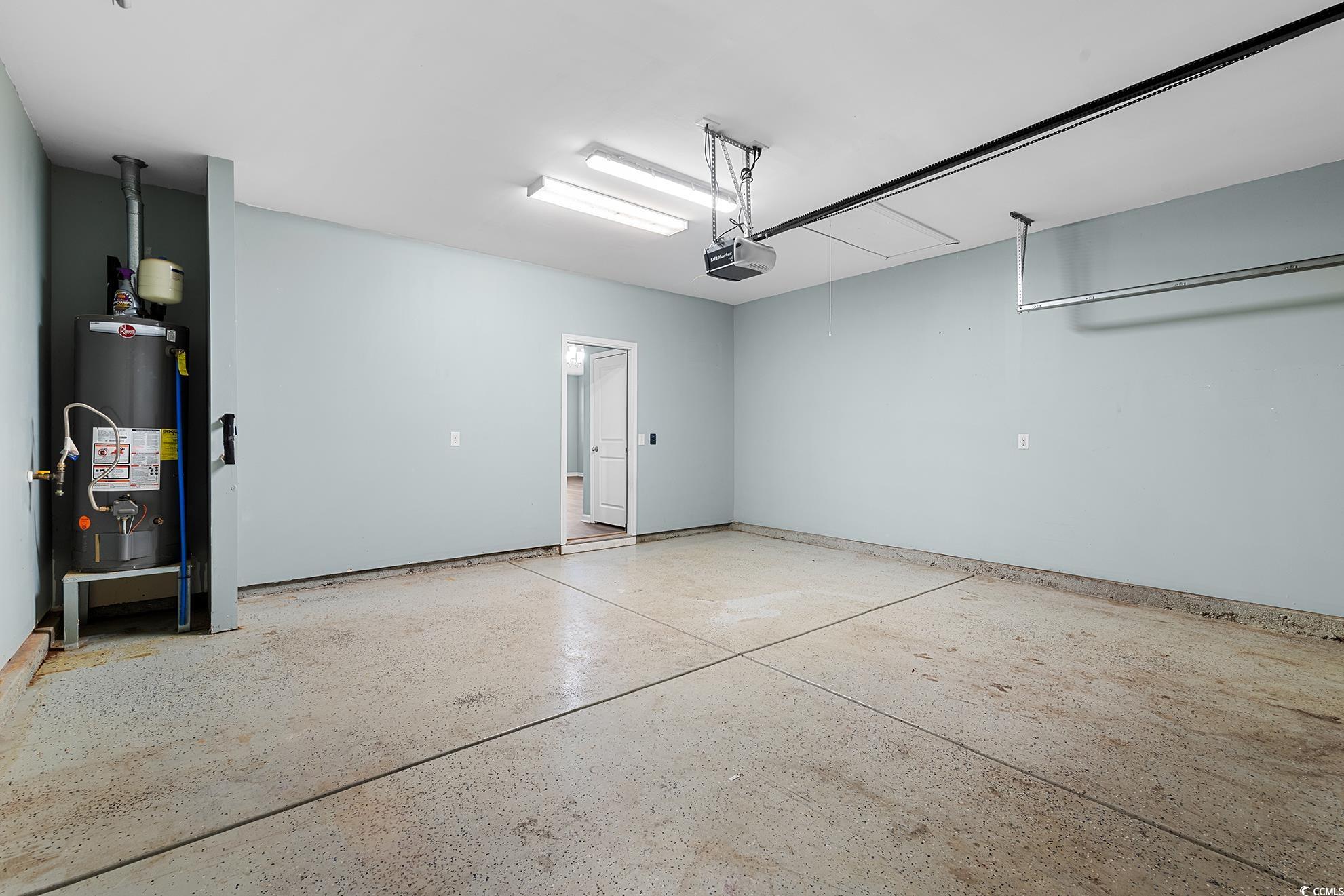 292 Carmello Circle Conway, SC 29526 - Photo 24 of 33 Garage featuring gas water heater and a garage door opener
