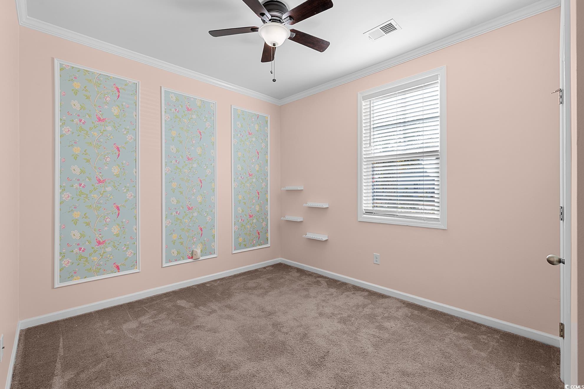 292 Carmello Circle Conway, SC 29526 - Photo 7 of 33 Carpeted empty room featuring ornamental molding and ceiling fan