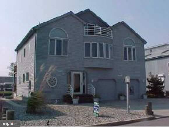 114 Clifton Road Barnegat, NJ 08005 - Photo 1 of 6 a front view of a house with garden