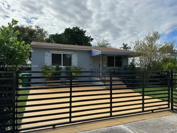 a view of a house with a fence
