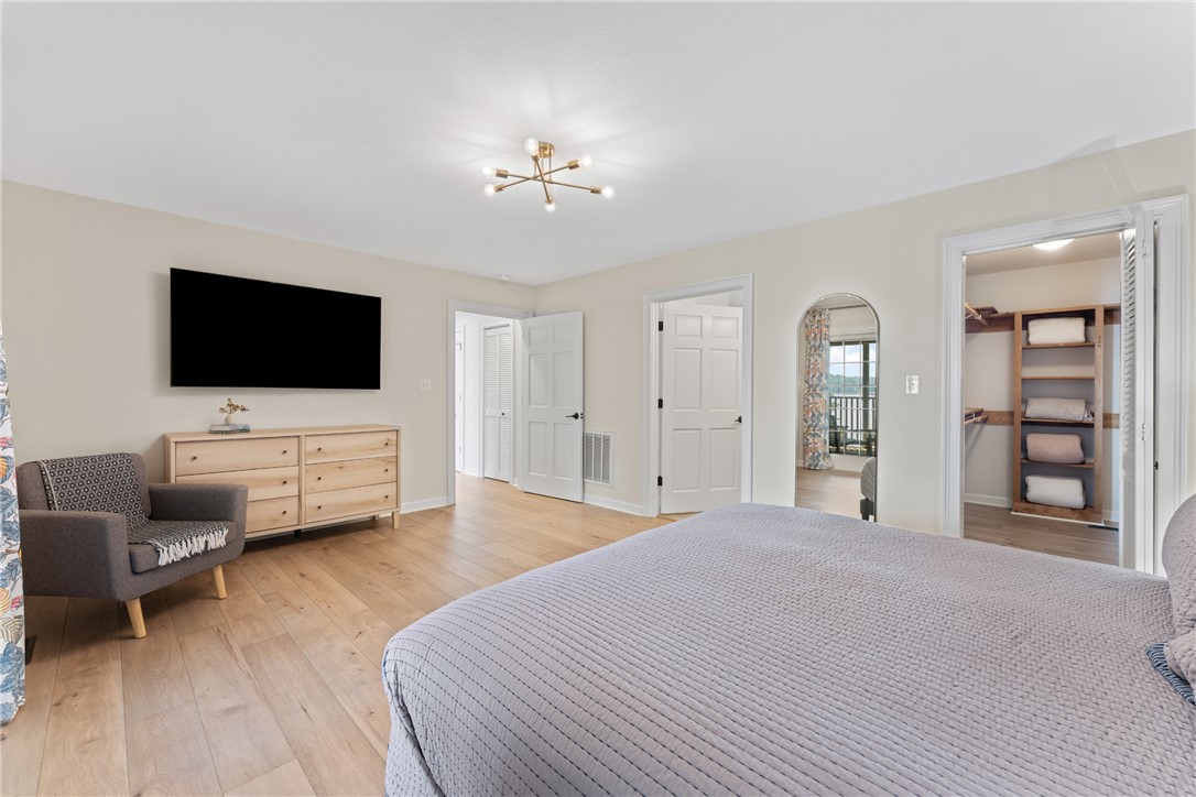 622 Jackson Road Anderson, SC 29626 - Photo 24 of 50 Blonde hardwood flooring complements the naturally illuminated interior of this spacious primary bedroom.