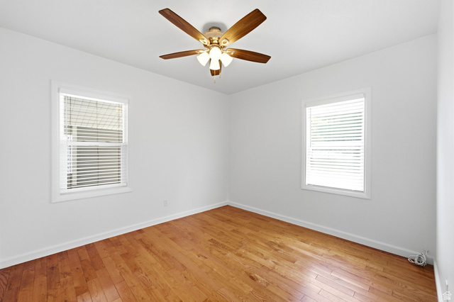 1925 South Main Street Bountiful, UT 84010 - Photo 19 of 48 Bright interior featuring wood-finish flooring, white walls, and a ceiling fan with integrated lighting