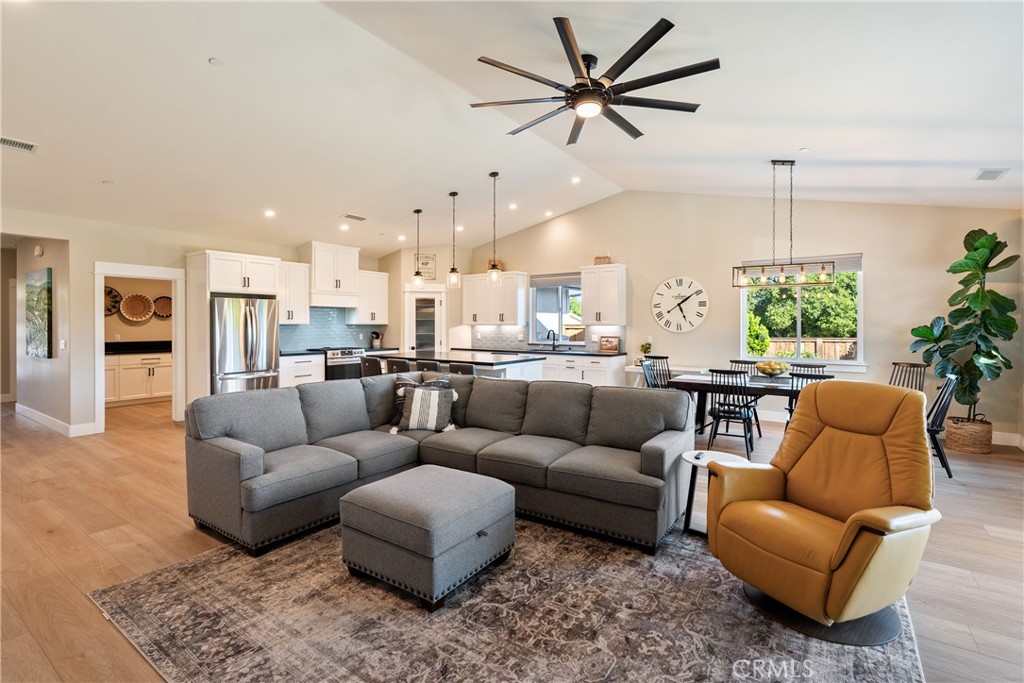 8550 El Corte Road Atascadero, CA 93422 - Photo 15 of 72 a living room with furniture kitchen view and a chandelier