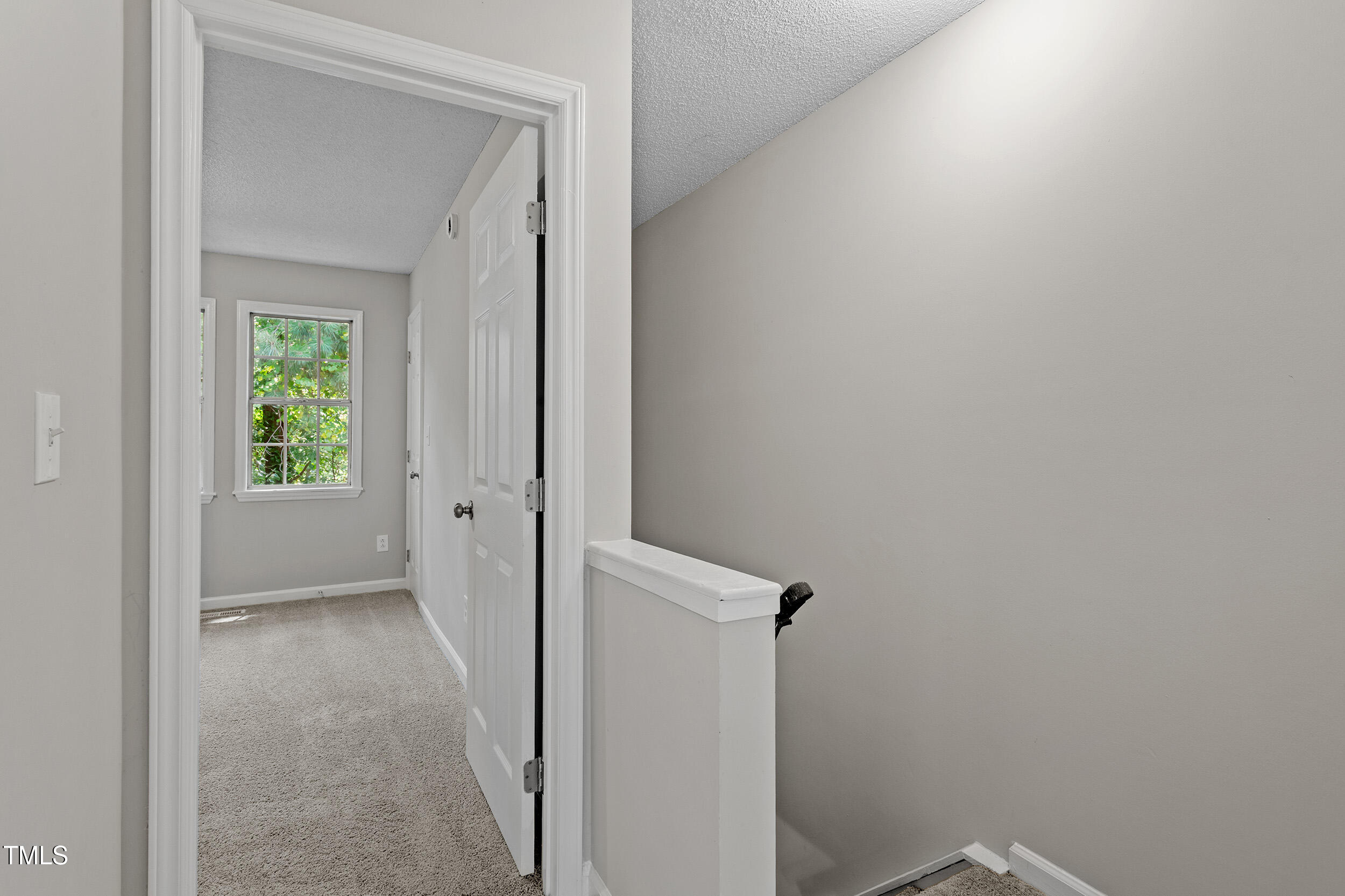 4242 Kaplan Drive Raleigh, NC 27606 - Photo 25 of 30 a view of a hallway with a closet