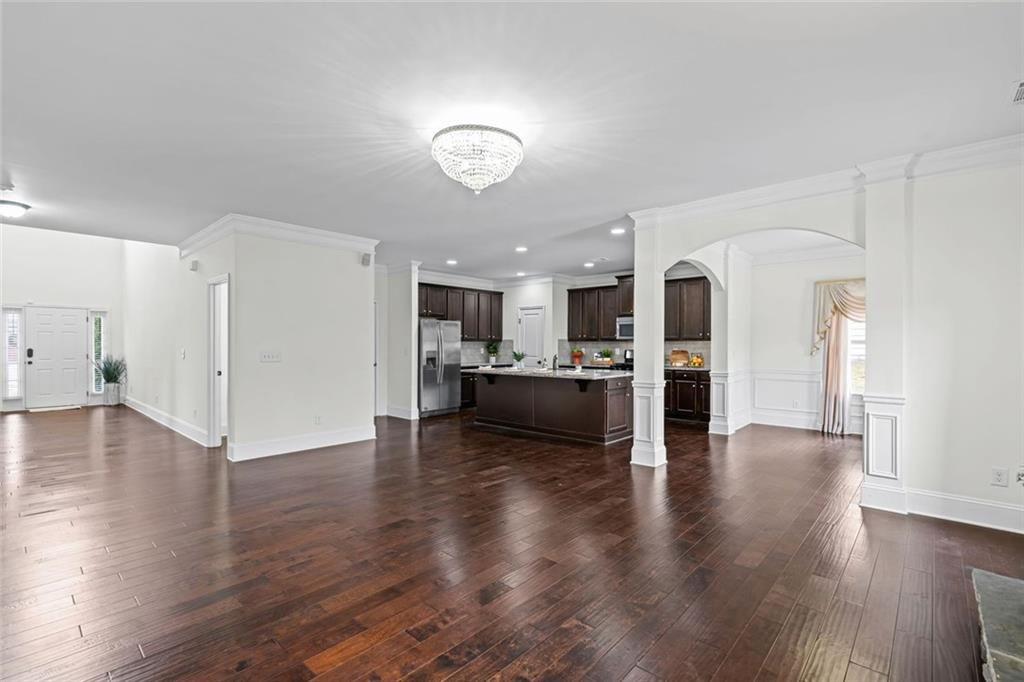 3915 Estates Path Cumming, GA 30040 - Photo 13 of 50 a view of a kitchen with furniture and wooden floor