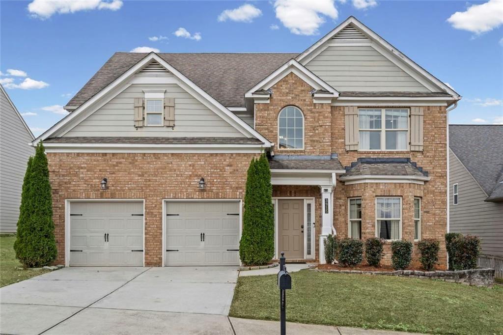 3915 Estates Path Cumming, GA 30040 - Photo 2 of 50 front view of a house with a yard