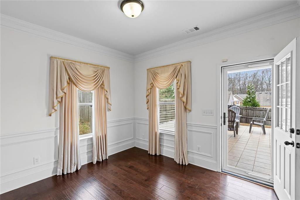 3915 Estates Path Cumming, GA 30040 - Photo 24 of 50 an empty room with wooden floor and windows