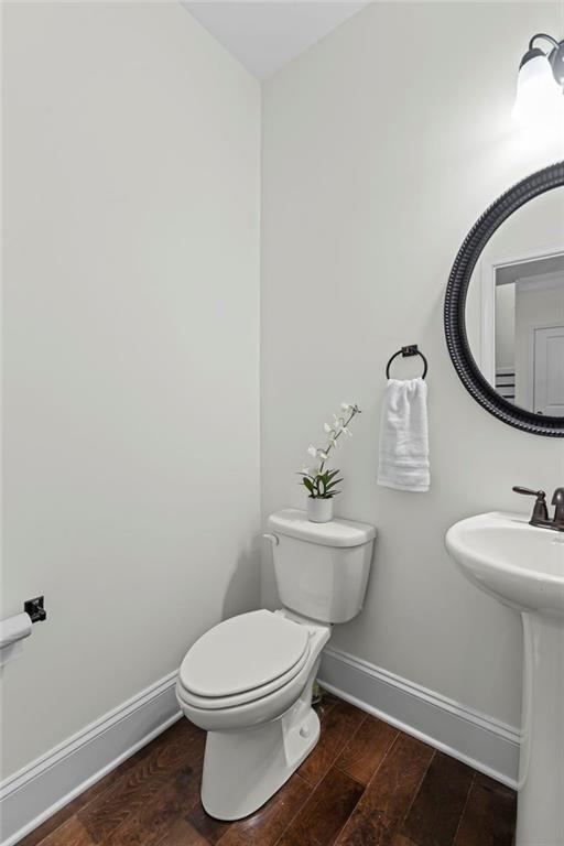 3915 Estates Path Cumming, GA 30040 - Photo 27 of 50 a bathroom with a toilet a sink and mirror