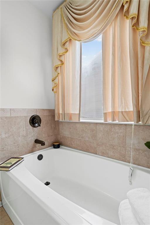 3915 Estates Path Cumming, GA 30040 - Photo 33 of 50 a bathroom with a tub and a sink