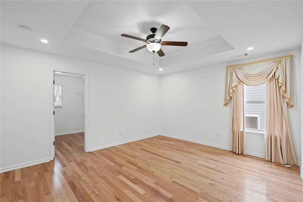 3915 Estates Path Cumming, GA 30040 - Photo 38 of 50 wooden floor in an empty room with a window