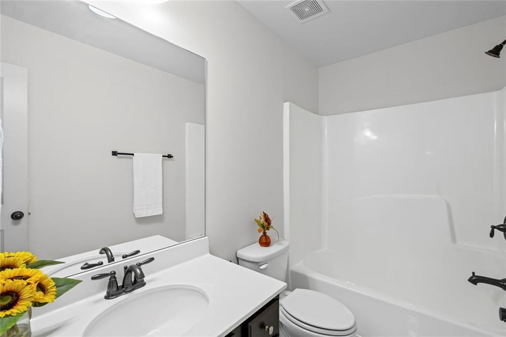 3915 Estates Path Cumming, GA 30040 - Photo 39 of 50 a bathroom with a sink toilet and shower