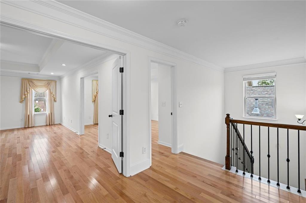 3915 Estates Path Cumming, GA 30040 - Photo 43 of 50 a view of a hallway with wooden floor and entryway