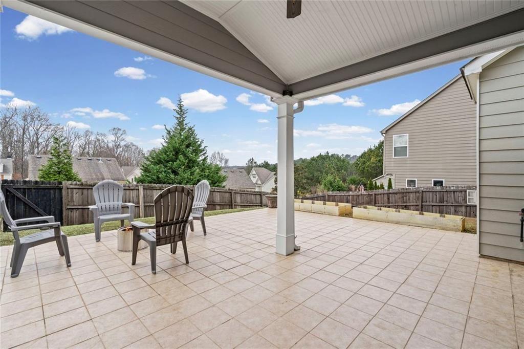 3915 Estates Path Cumming, GA 30040 - Photo 44 of 50 a view of a patio with a table chairs and a patio