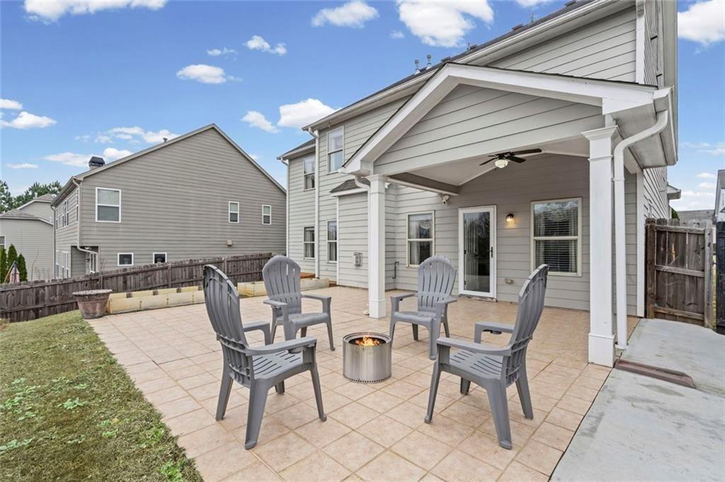 3915 Estates Path Cumming, GA 30040 - Photo 46 of 50 a view of a patio with table and chairs