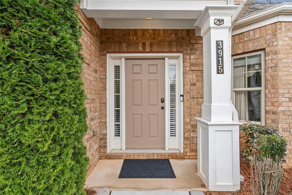 3915 Estates Path Cumming, GA 30040 - Photo 5 of 50 a front view of a house with a yard
