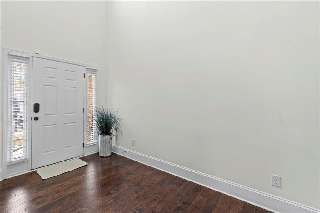 3915 Estates Path Cumming, GA 30040 - Photo 7 of 50 a view of an empty room with wooden floor