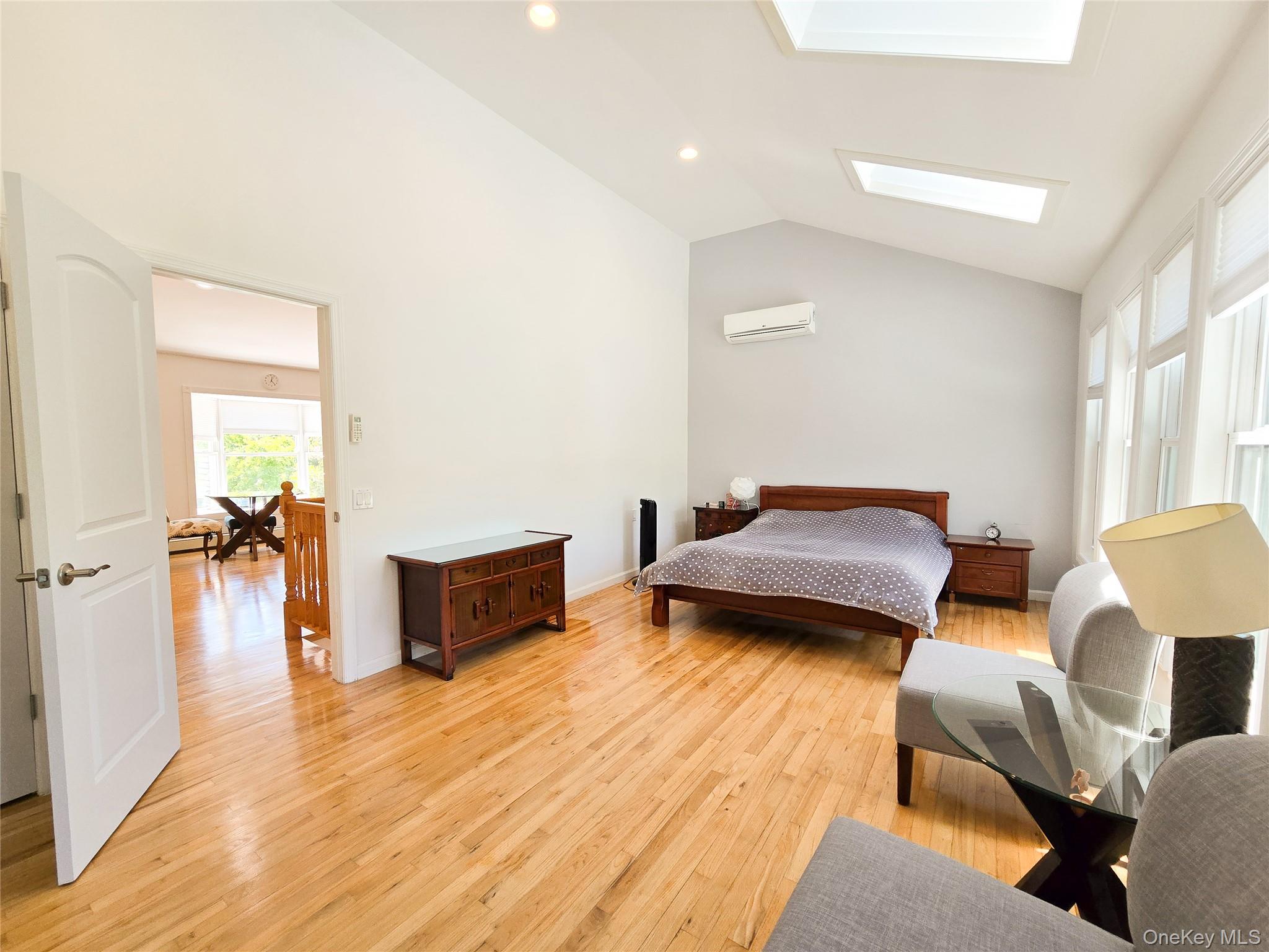 249 Cold Spring Road Syosset, NY 11791 - Photo 13 of 28 a bedroom with furniture and a wooden floor