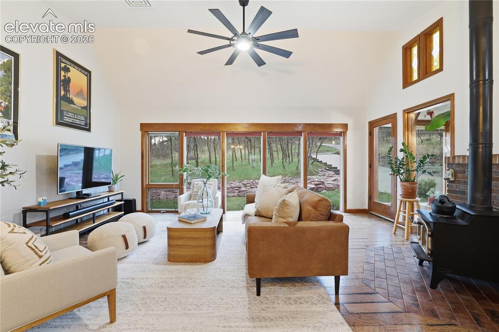 18190 Forest View Road Monument, CO 80132 - Photo 2 of 50 a living room with furniture and a flat screen tv