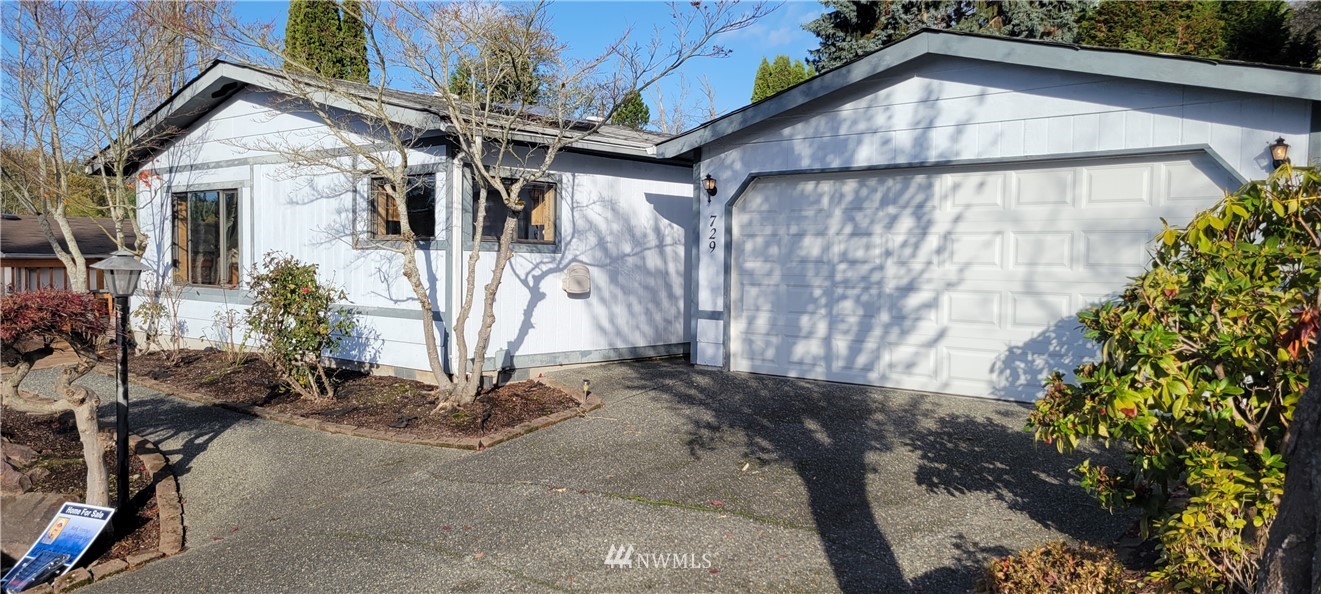 729 236th Place Southwest Bothell, WA 98021 - Photo 1 of 40 a view of a house with a yard