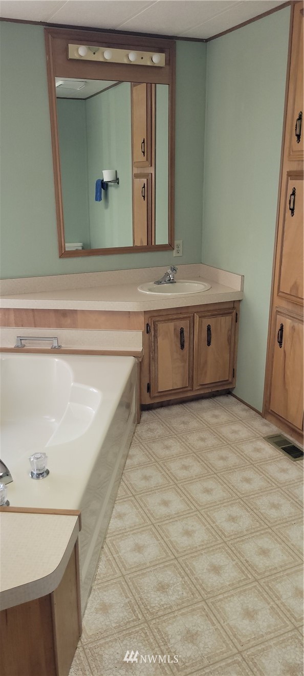 729 236th Place Southwest Bothell, WA 98021 - Photo 27 of 40 a bathroom with a sink and a mirror