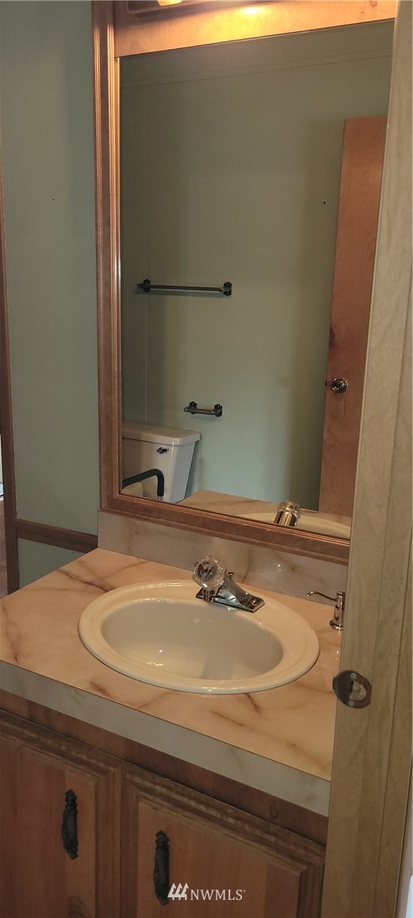 729 236th Place Southwest Bothell, WA 98021 - Photo 33 of 40 a bathroom with a sink and a mirror