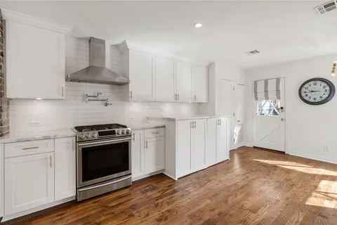 a kitchen with a stove and a microwave