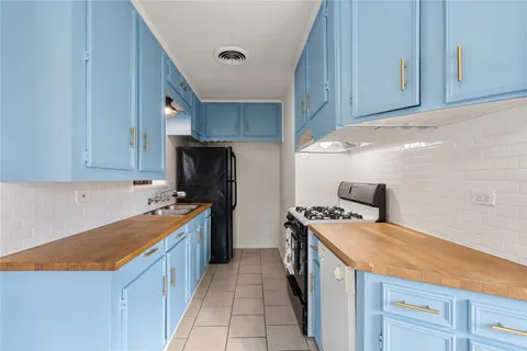 a kitchen with a stove and a refrigerator