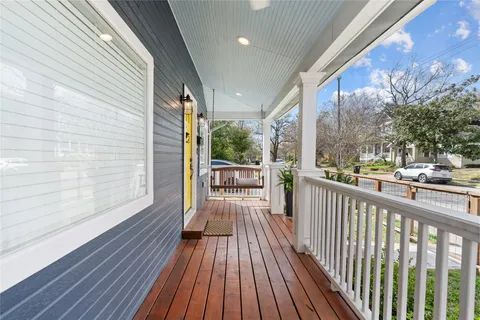 a view of a balcony with wooden floor