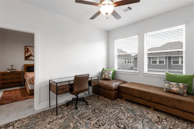 a living room with furniture and windows