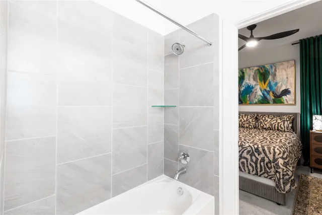 a bathroom with a shower and toilet