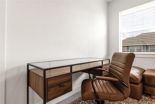 a view of a chair and table in the balcony