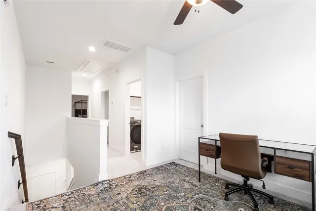 a living room with furniture and a rug