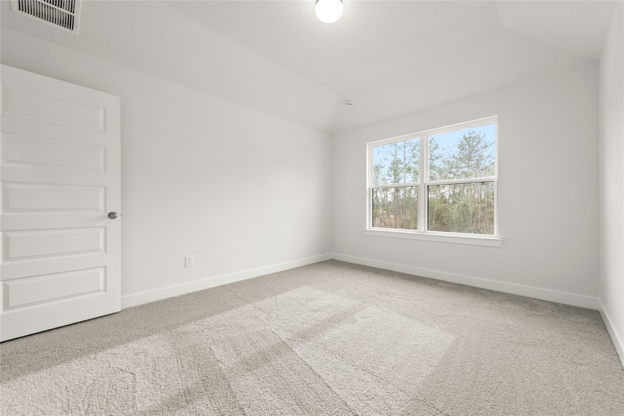 18917 Moonriver Street Conroe, TX 77302 - Photo 19 of 28 an empty room with windows