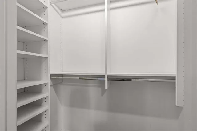 a view of an empty walk in closet