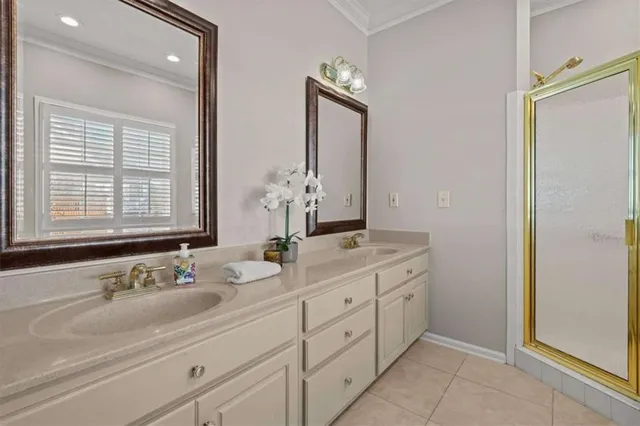 a bathroom with double sink and a mirror
