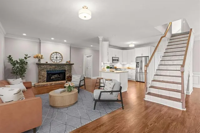 a living room with furniture and a fireplace