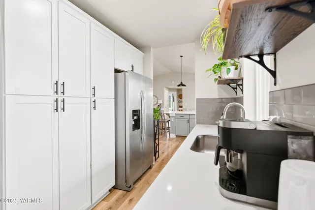 a view of living room with furniture and chandelier