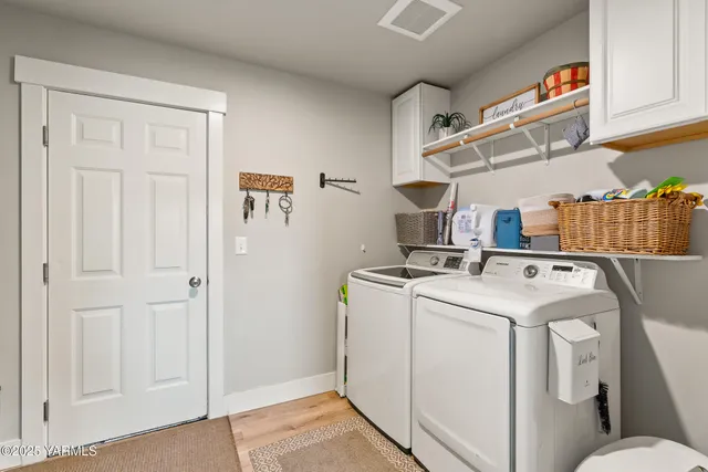 a kitchen with stainless steel appliances granite countertop a refrigerator a stove and a sink