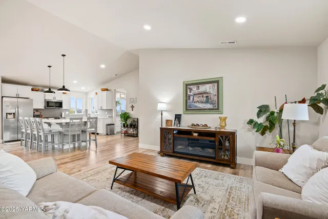 a living room with furniture and a table