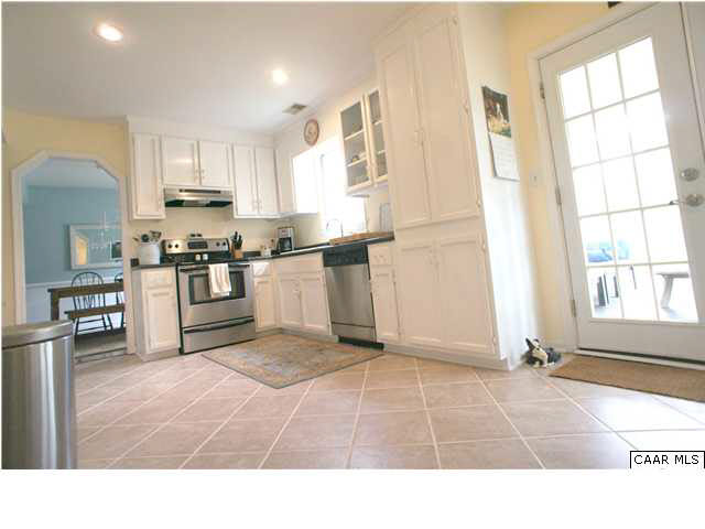 111 Rustling Oaks Way Ruckersville, VA 22968 - Photo 6 of 16 a open kitchen with stainless steel appliances granite countertop a stove a sink and a refrigerator