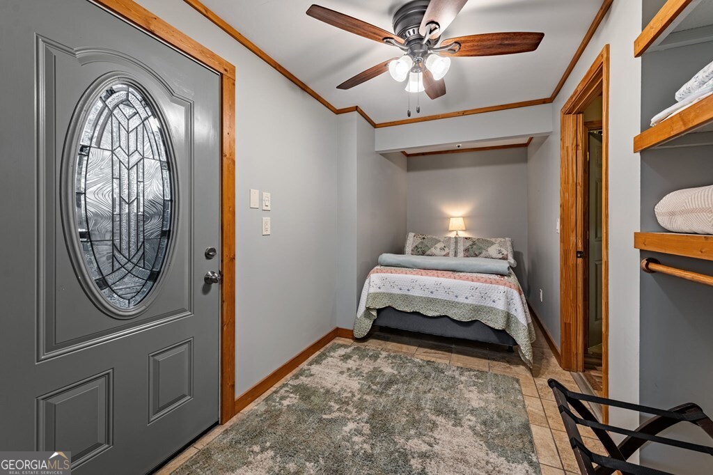 90 Hay Lane Morganton, GA 30560 - Photo 43 of 77 a bedroom with a bed and a chandelier