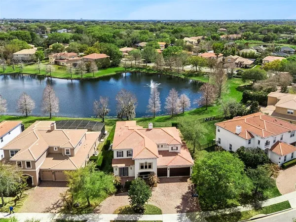 an aerial view of a house with a lake view