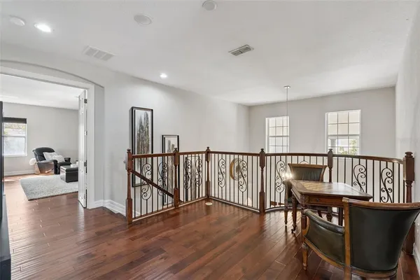 a view of a dining room with furniture window and wooden floor